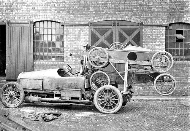 Car wheels parked building brick free wallpaper for desktop - medium preview image