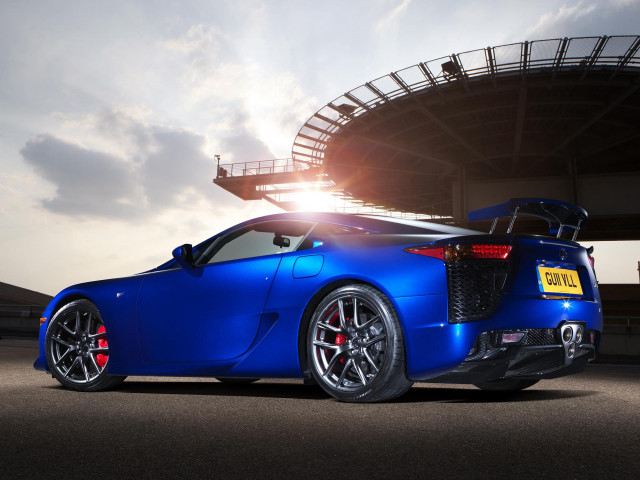 Blue sports car stadium sun free wallpaper for desktop - medium preview image