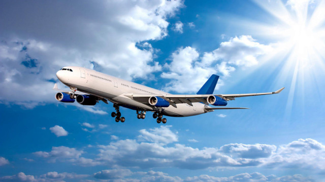 Jetliner flying blue sky clouds #14 free wallpaper for desktop - medium preview image