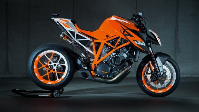 Motorcycle orange rims garage concrete free wallpaper for desktop - medium preview image