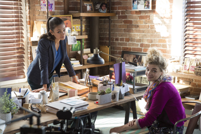 Woman standing woman sitting table free wallpaper for desktop - medium preview image