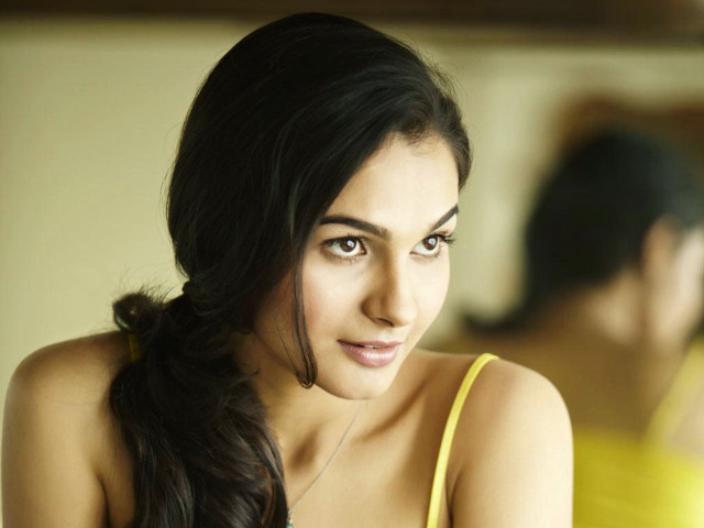 Woman yellow top serious look free wallpaper for desktop - medium preview image