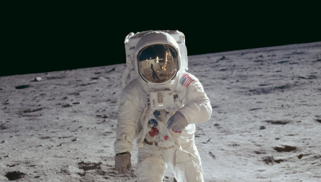 Astronaut walking on moon space free wallpaper for desktop - medium preview image