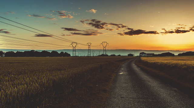 Road field powerlines sunset horizon free wallpaper for desktop - medium preview image