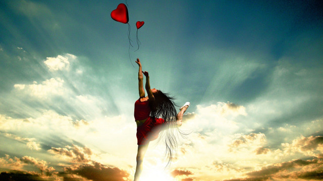 Woman flying kite heart shaped free wallpaper for desktop - medium preview image