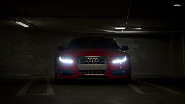 Red car parked night headlights free wallpaper for desktop - medium preview image