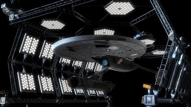 Large spaceship lit up military free wallpaper for desktop - medium preview image