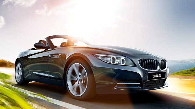 Black car driving road sky free wallpaper for desktop - medium preview image