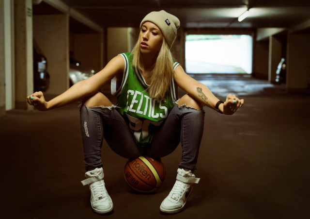 Athletic woman sitting basketball parking free wallpaper for desktop - medium preview image