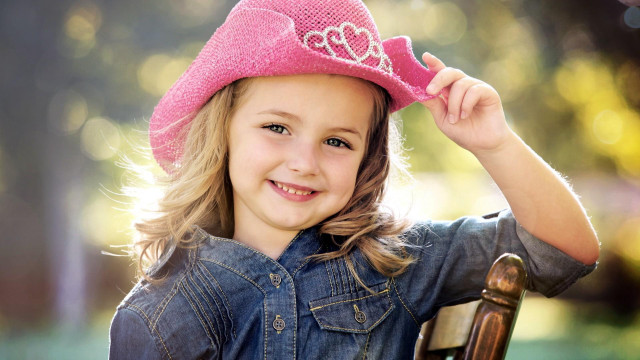 Little girl pink hat smiling free wallpaper for desktop - medium preview image