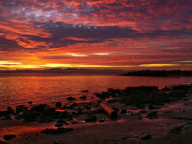 Sunset water rocks shore mountain free wallpaper for desktop - medium preview image