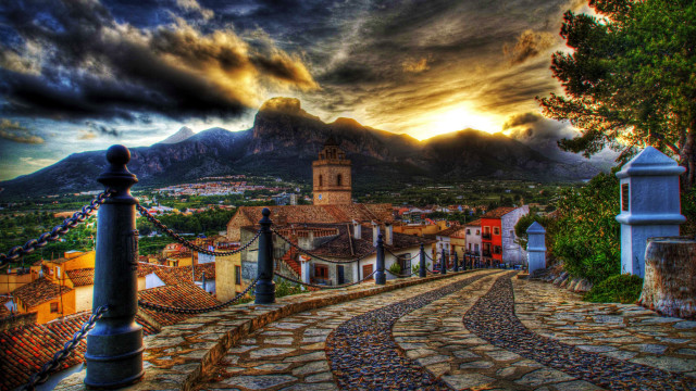 Cobblestone road church village mountains free wallpaper for desktop - medium preview image