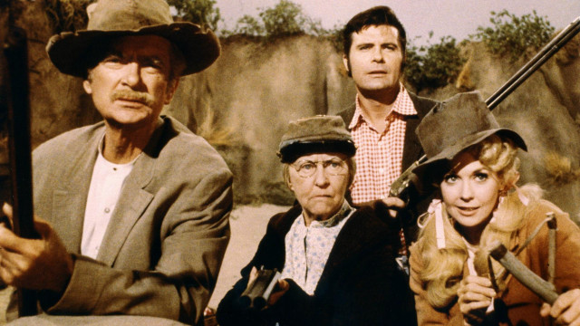 Group people guns hats sitting free wallpaper for desktop - medium preview image