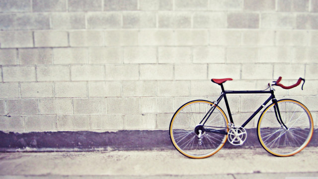 Bike parked street brick wall free wallpaper for desktop - medium preview image