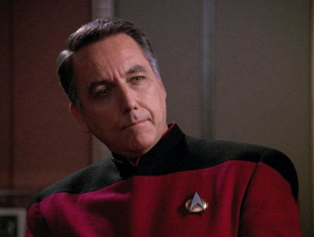 Man red uniform serious look free wallpaper for desktop - medium preview image