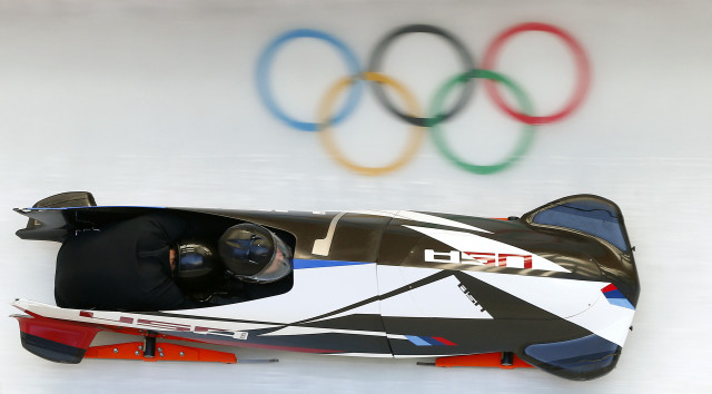 Person car olympic sign wall free wallpaper for desktop - medium preview image