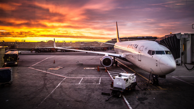 Plane parked tarmac airport sunset #4 free wallpaper for desktop - medium preview image