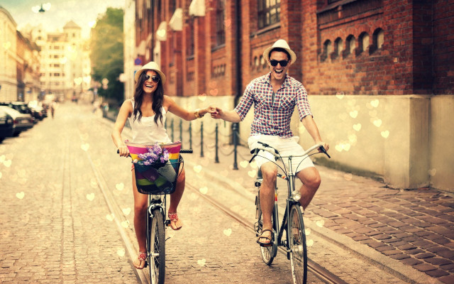 Man woman biking holding hands free wallpaper for desktop - medium preview image