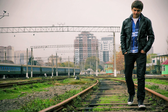 Man standing train track city #2 free wallpaper for desktop - medium preview image