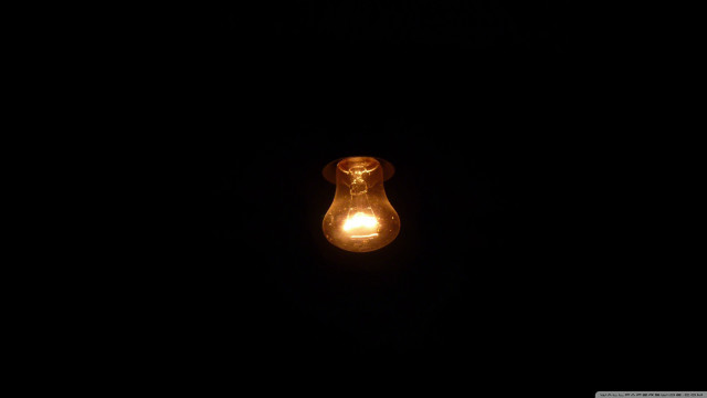 Lit bulb dark night glow free wallpaper for desktop - medium preview image