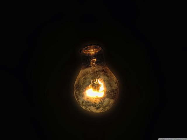 Light bulb glowing yellow reflection free wallpaper for desktop - medium preview image