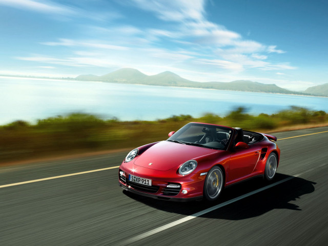 Red sports car driving road #32 free wallpaper for desktop - medium preview image