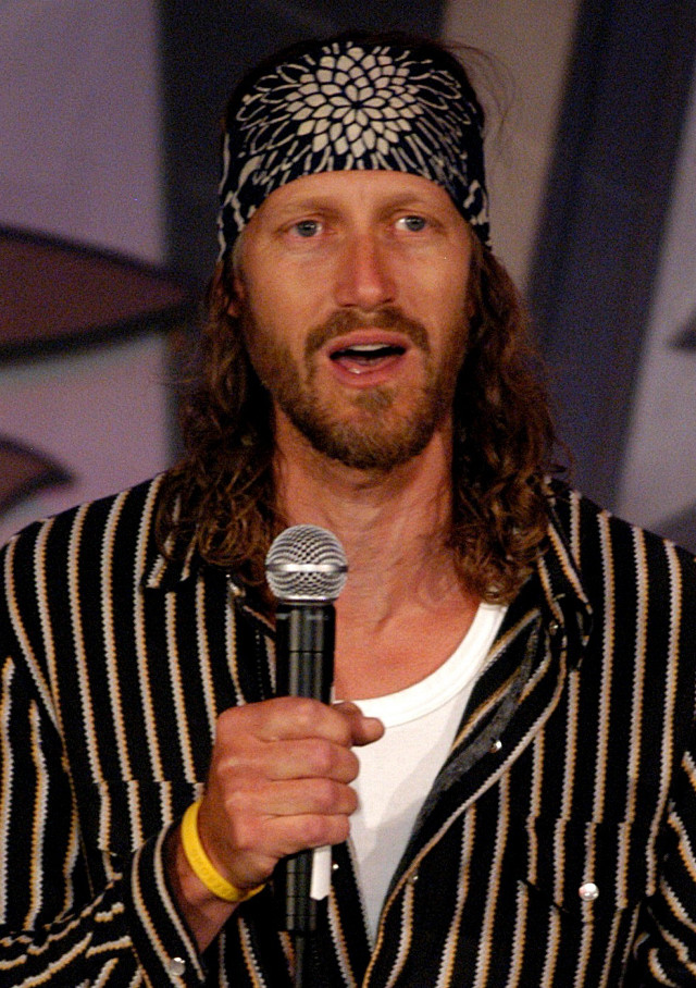 Man microphone speaking hat hand free wallpaper for mobile - medium preview image