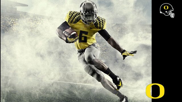 Football player yellow uniform running free wallpaper for desktop - medium preview image
