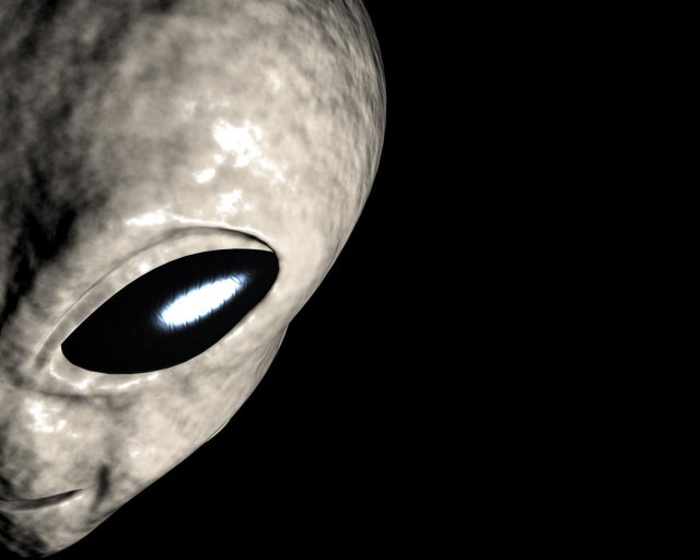 Alien blue eye black background free wallpaper for desktop - medium preview image