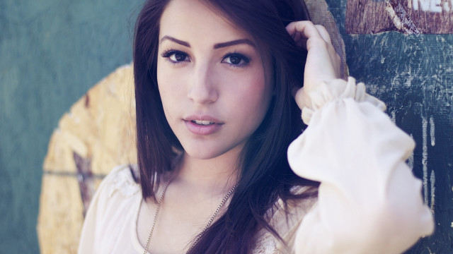 Woman long hair leaning wall #3 free wallpaper for desktop - medium preview image