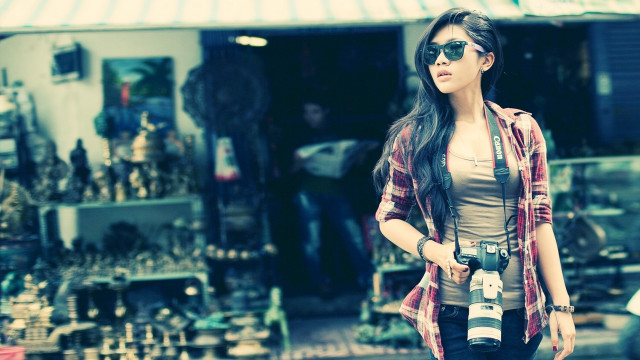 Woman holding camera store items free wallpaper for desktop - medium preview image