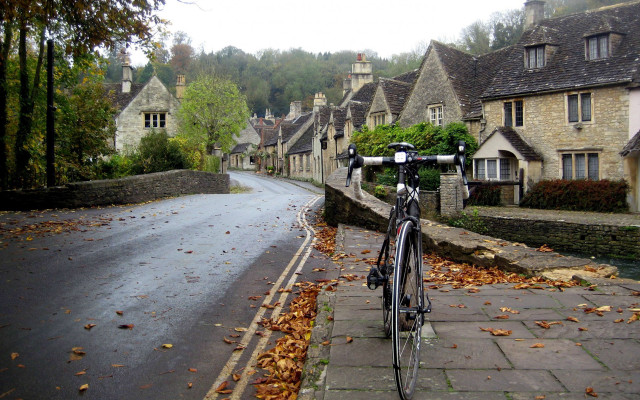 Bicycle parked road houses hill free wallpaper for desktop - medium preview image