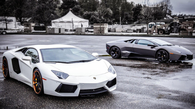 Two white sports cars rainy free wallpaper for desktop - medium preview image