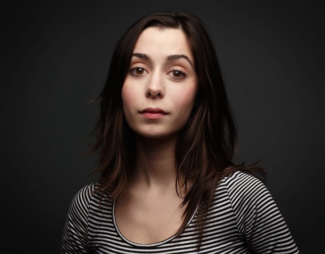 Woman striped shirt black background free wallpaper for desktop - medium preview image