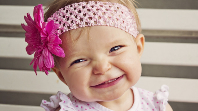 Little girl pink flower smiling free wallpaper for desktop - medium preview image