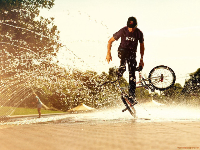 Man bike tricks water hoses free wallpaper for desktop - medium preview image