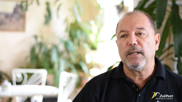 Man black shirt looking camera free wallpaper for desktop - medium preview image