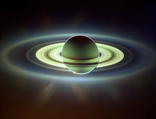 Saturn ring sunbeam space art free wallpaper for desktop - medium preview image