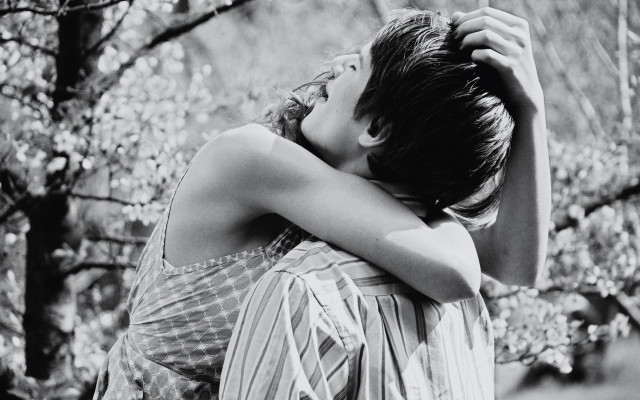 Woman hugging head forest blurry free wallpaper for desktop - medium preview image