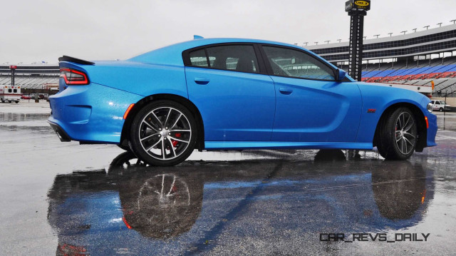 Blue sports car rainy day free wallpaper for desktop - medium preview image