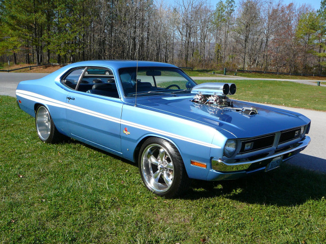 Blue car parked green field free wallpaper for desktop - medium preview image