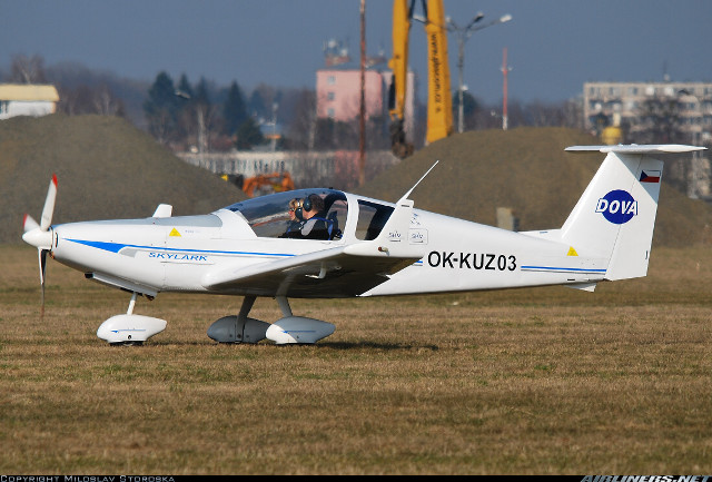 Small airplane grass field building free wallpaper for desktop - medium preview image