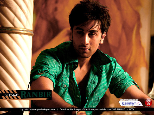 Man green shirt tie sitting free wallpaper for desktop - medium preview image