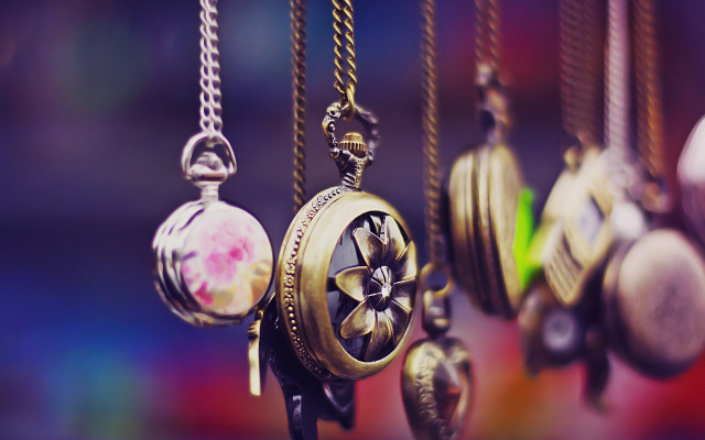 Colored clocks hanging chains wall free wallpaper for desktop - medium preview image
