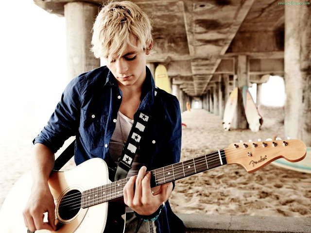 Man holding guitar beach pier free wallpaper for desktop - medium preview image