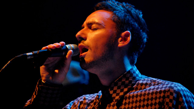 Man singing microphone stage concert free wallpaper for desktop - medium preview image