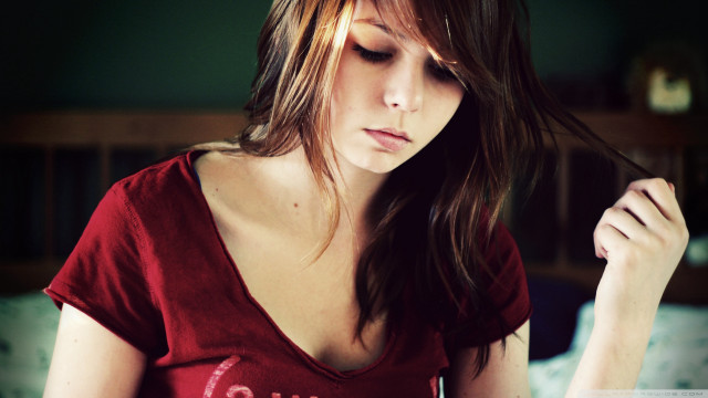 Woman red shirt sitting bed free wallpaper for desktop - medium preview image