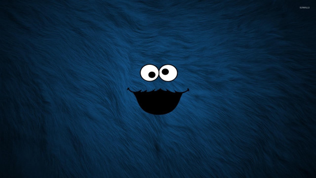 Blue furry animal smiling face free wallpaper for desktop - medium preview image