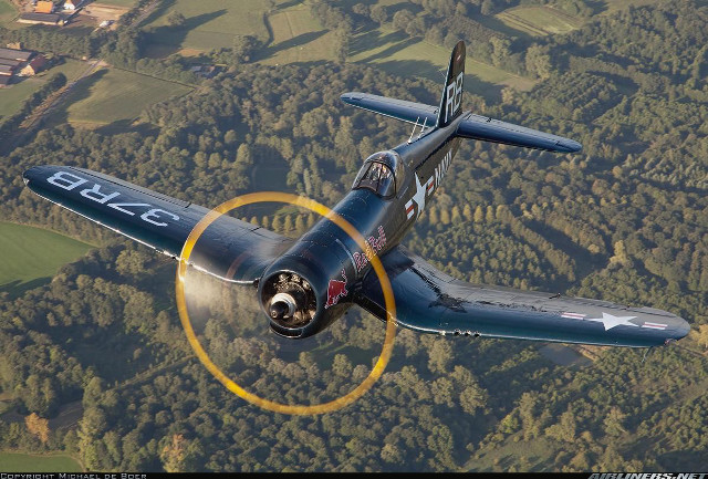 Small airplane flying lush green free wallpaper for desktop - medium preview image