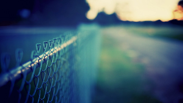 Chain link fence person walking free wallpaper for desktop - medium preview image